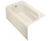 Kohler Devonshire K-1357-GLA-47 Almond 5' BubbleMassage Bath Tub with Integral Apron, Left-Hand Drain